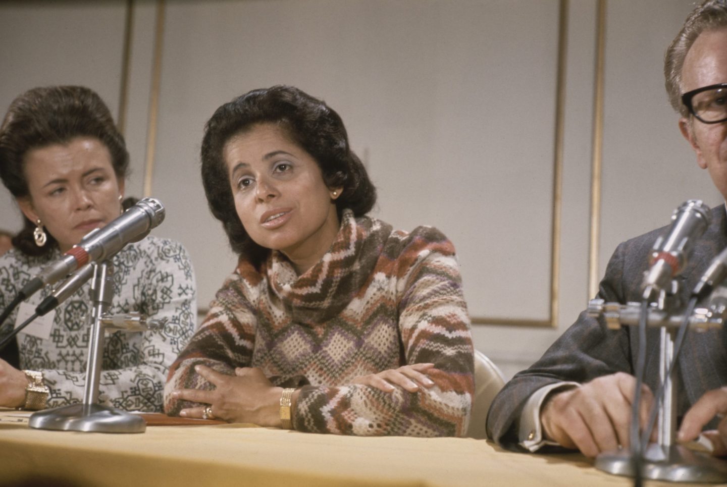 Patricia Roberts Harris sits before a microphone in 1972.