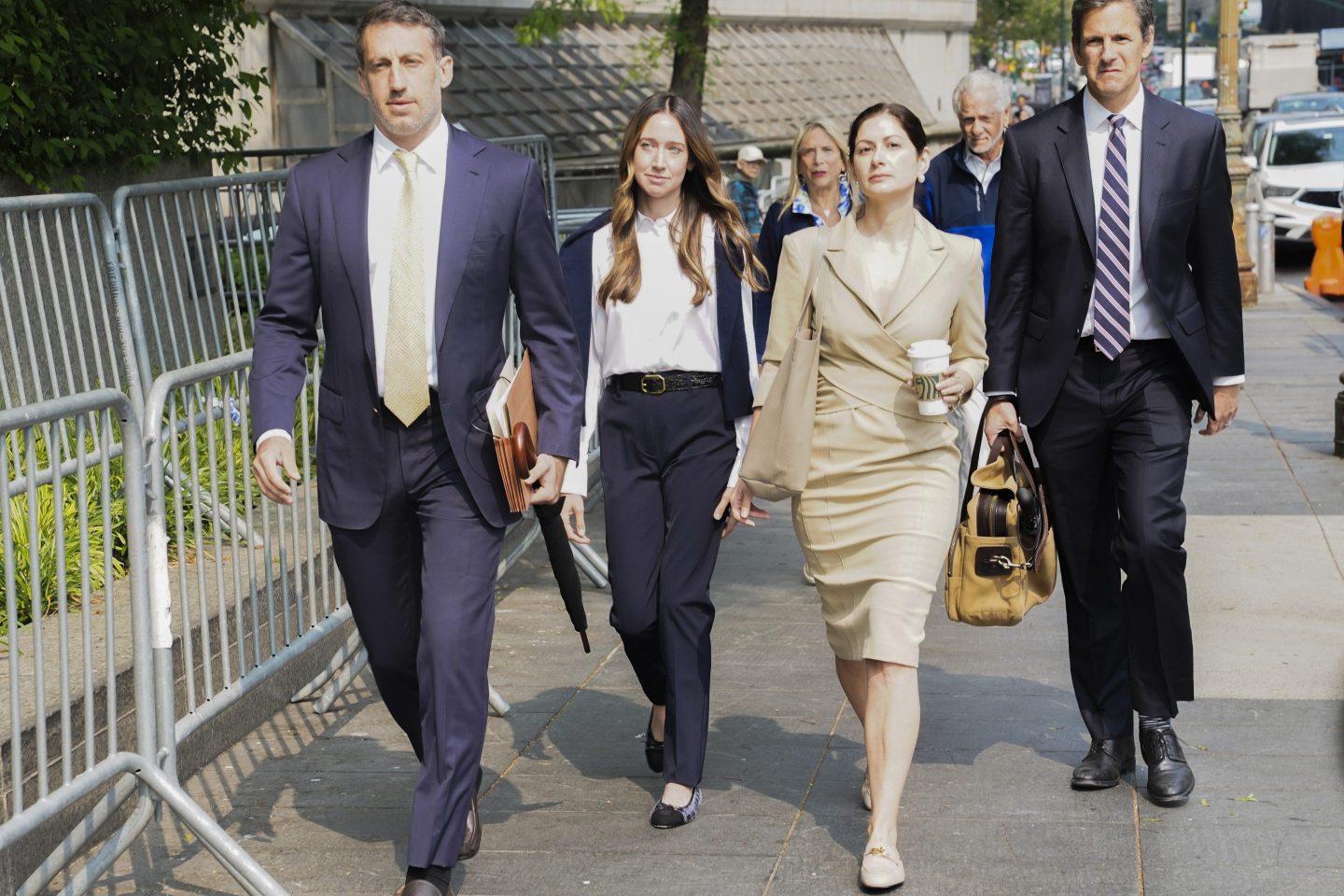 Charlie Javice, second from left, founder of a student loan assistance startup company charged with fraud, arrives at federal court with her legal team, June 6, 2023, in New York.