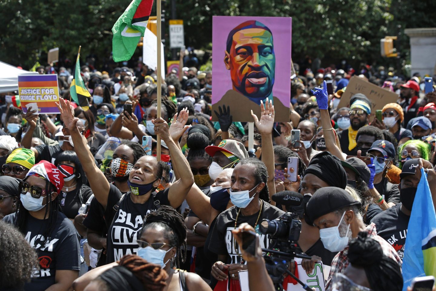 People participate in a Caribbean-led Black Lives Matter rally on June 14, 2020, at Brooklyn's Grand Army Plaza in New York.