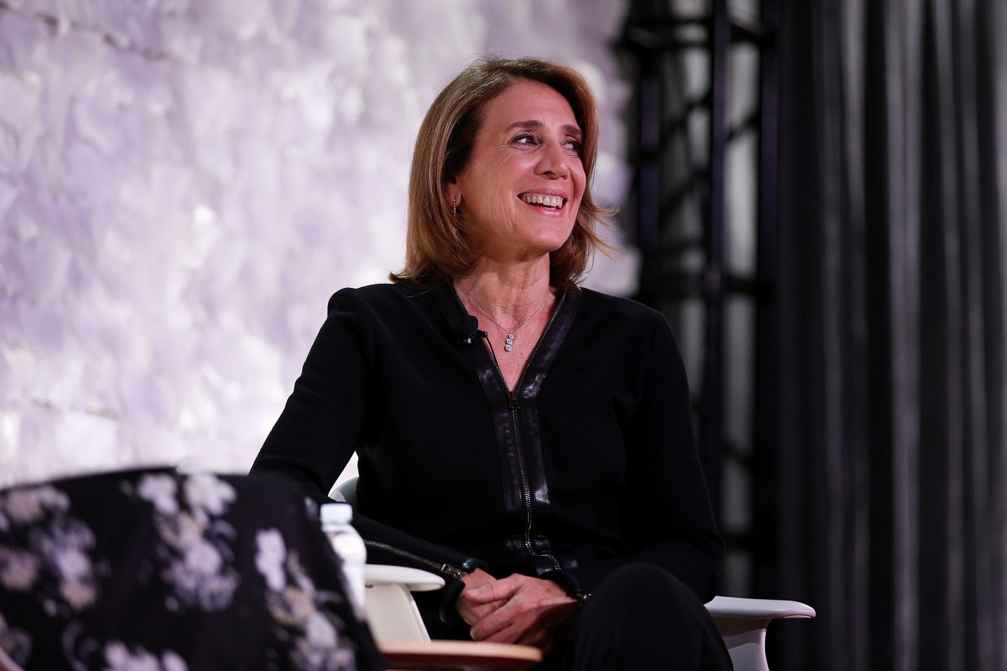 woman smiling onstage