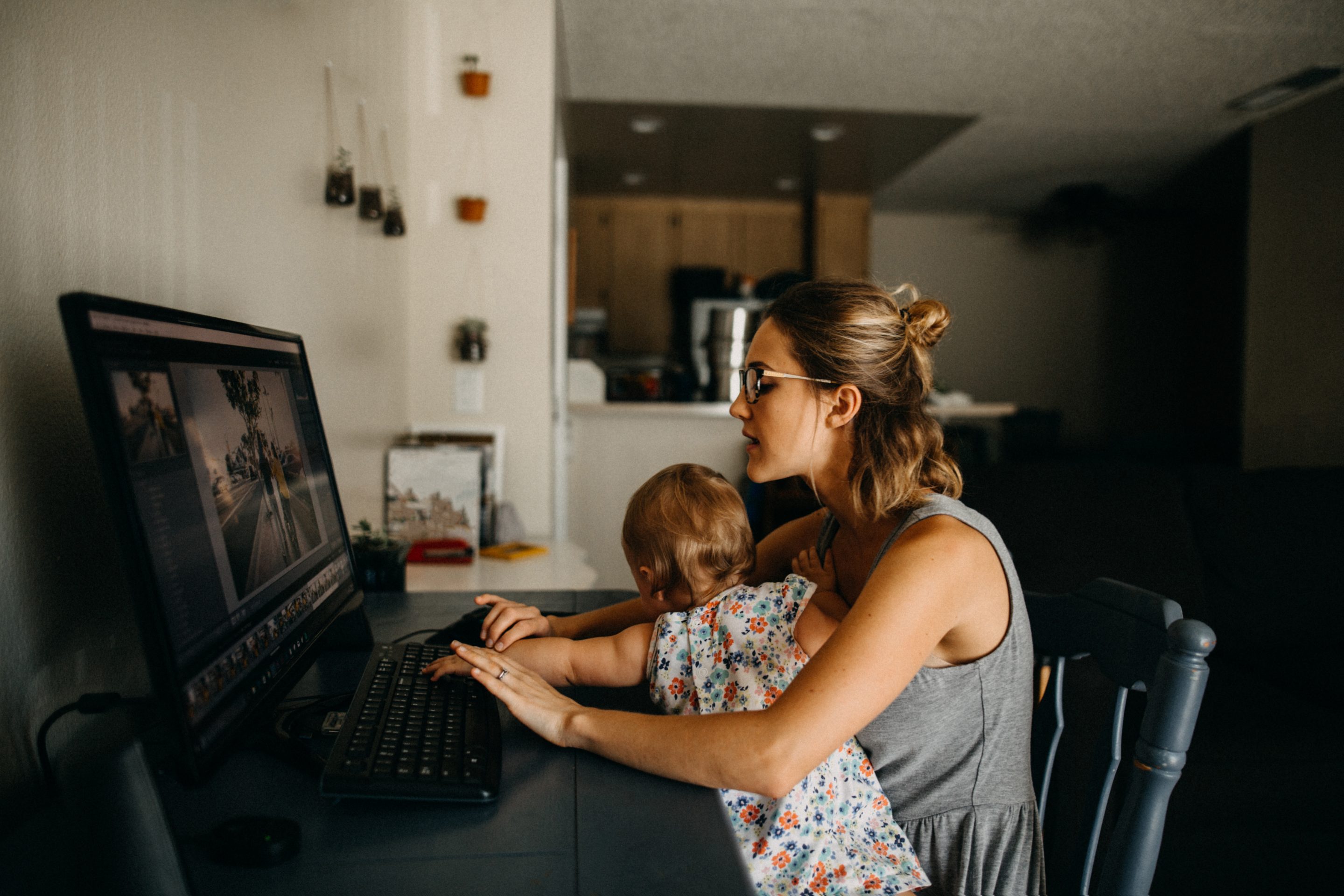 Mom with baby at laptop