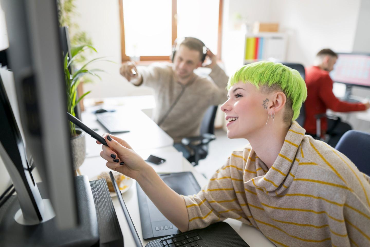 woman at laptop smiling