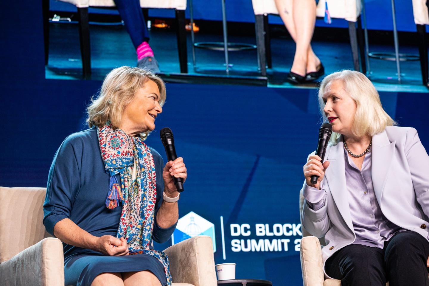 Sen. Cynthia Lummis, a Republican from Wyoming, and Sen. Kirsten Gillibrand, a Democrat from New York, speak during the D.C. Blockchain Summit in May 2022.