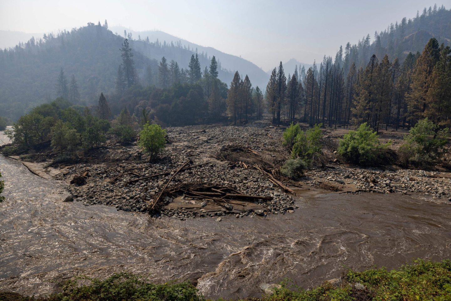 The Klamath River runs brown with mud after flash floods hit