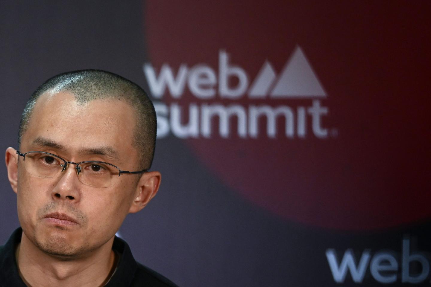 Changpeng Zhao, founder and CEO of Binance, speaks on stage during a 2022 conference in Portugal.