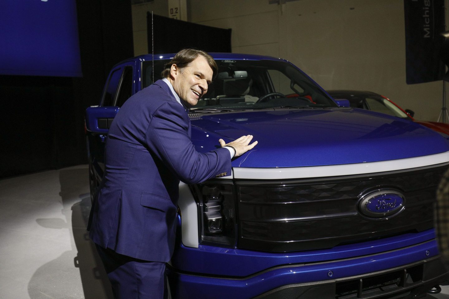 Ford CEO Jim Farley with a Ford F-150 Lightning truck.
