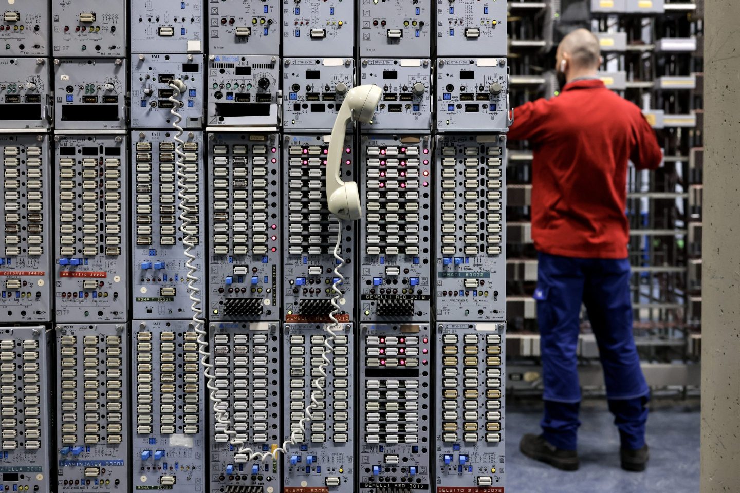 A technician performs checks in a Telecom Italia telephone exchange in Rome, on April 4, 2023.
