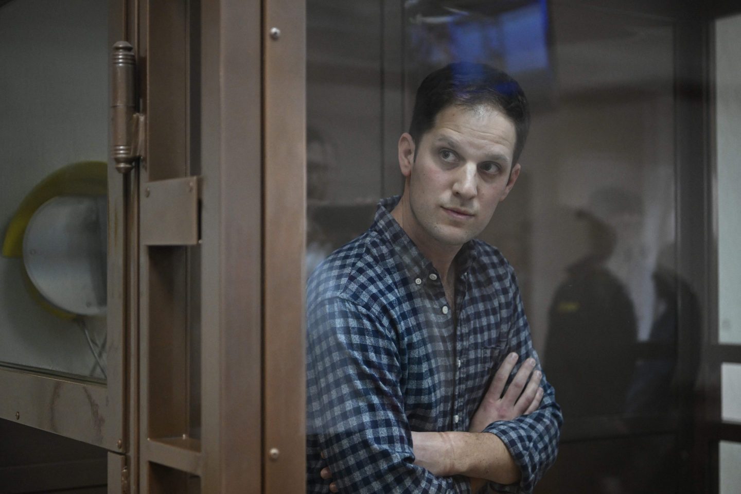 US journalist Evan Gershkovich, arrested on espionage charges, stands inside a defendants' cage before a hearing to consider an appeal on his arrest