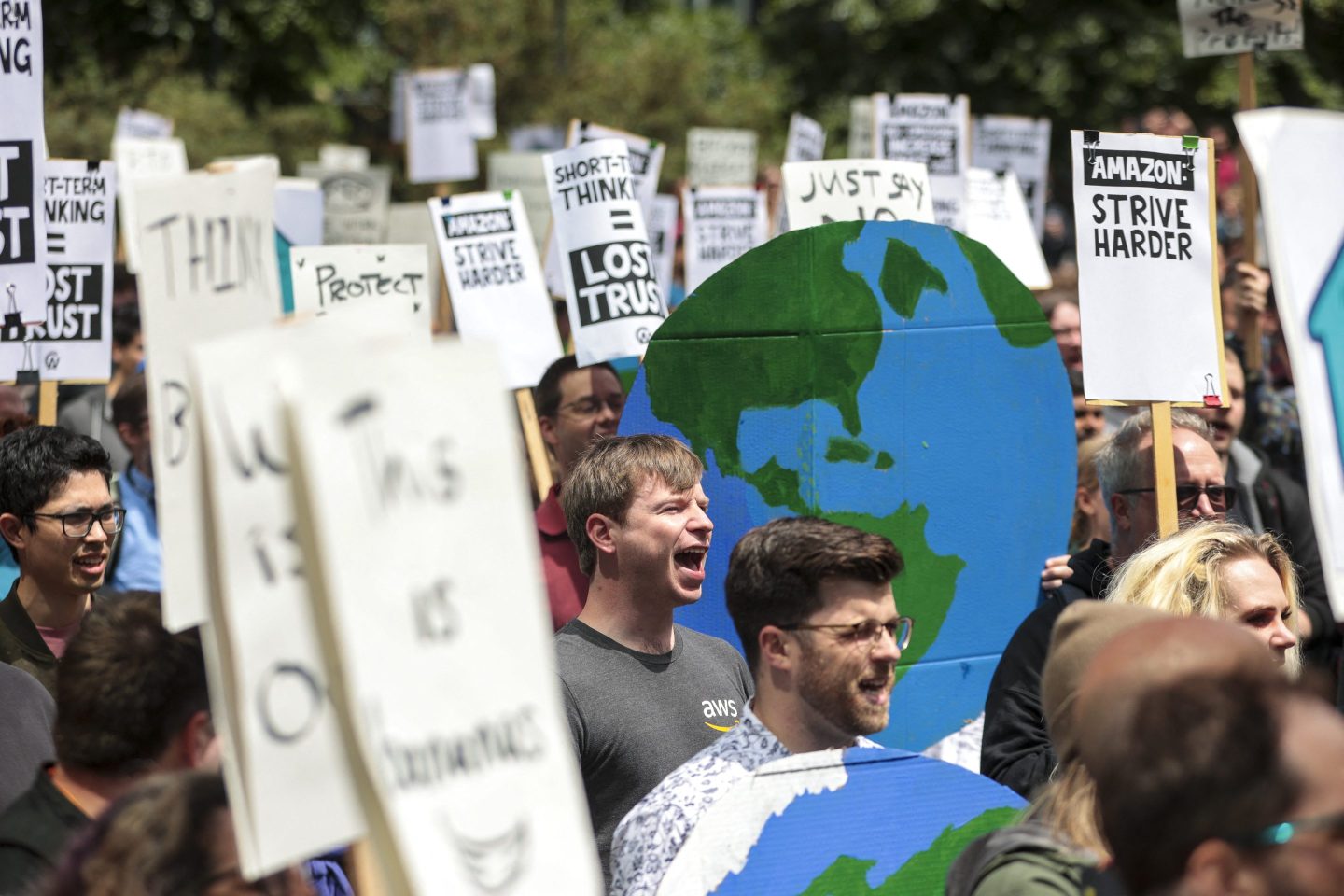 Amazon employees and supporters gather during a walk-out protest against recent layoffs, a return-to-office mandate, and the company's environmental impact in Seattle on May 31.