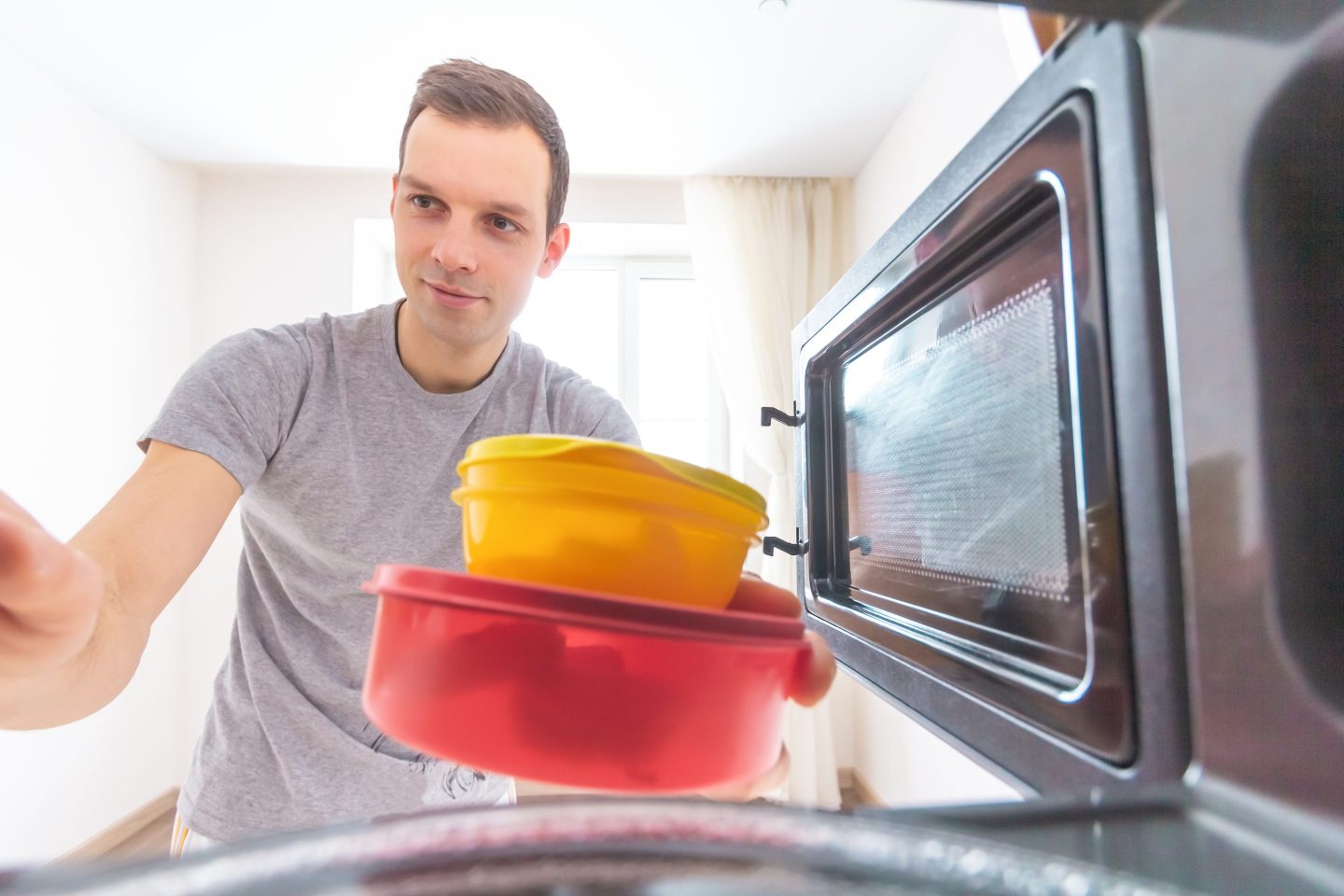 man using tupperware