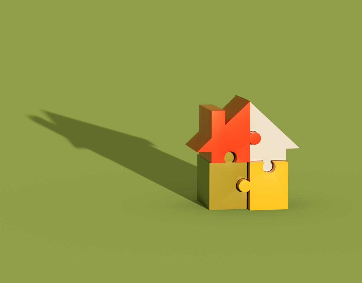 Model of a single-family home made up of puzzle pieces