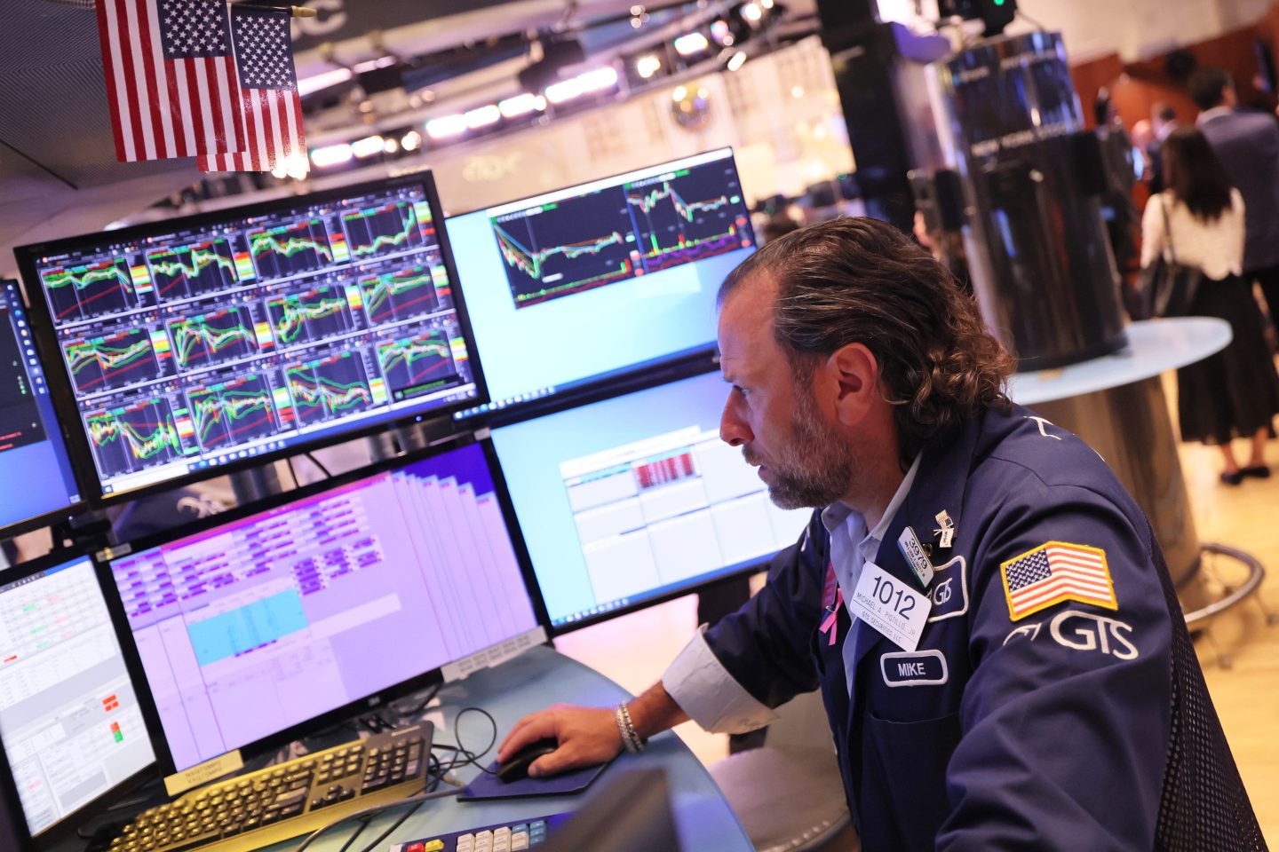 Traders work on the floor of the New York Stock Exchange.