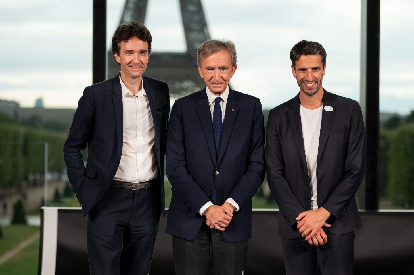 Antoine Arnault vice chairman of Christian Dior, from left, Bernard Arnault, billionaire and chairman of LVMH Moet Hennessy Louis Vuitton, and Tony Estanguet, president of the Paris 2024 Olympic and Paralympic games, during a news conference in Paris, on July 24, 2023. 