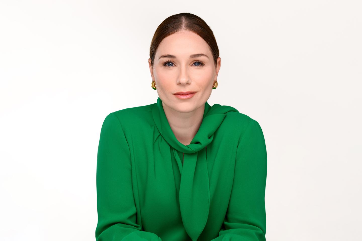 Woman wearing green blouse