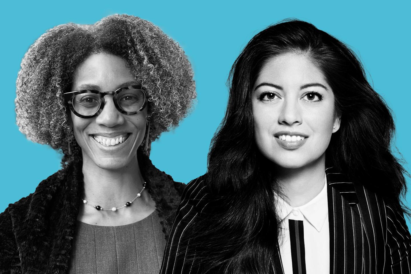 Two women smiling in front of blue background