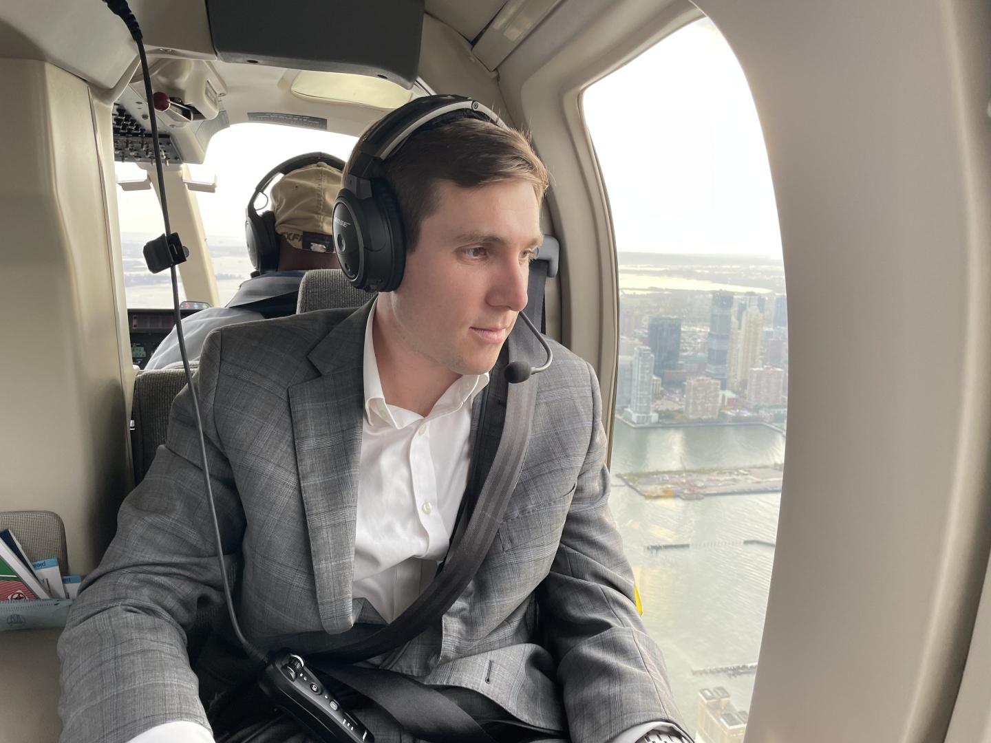 Matt Swain of Triago in a helicopter.