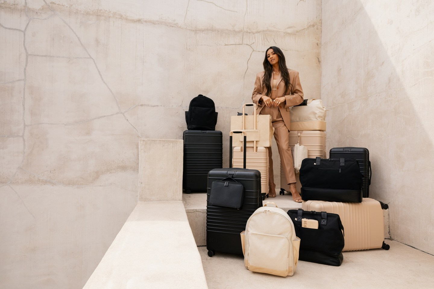 woman posing among pieces of luggage