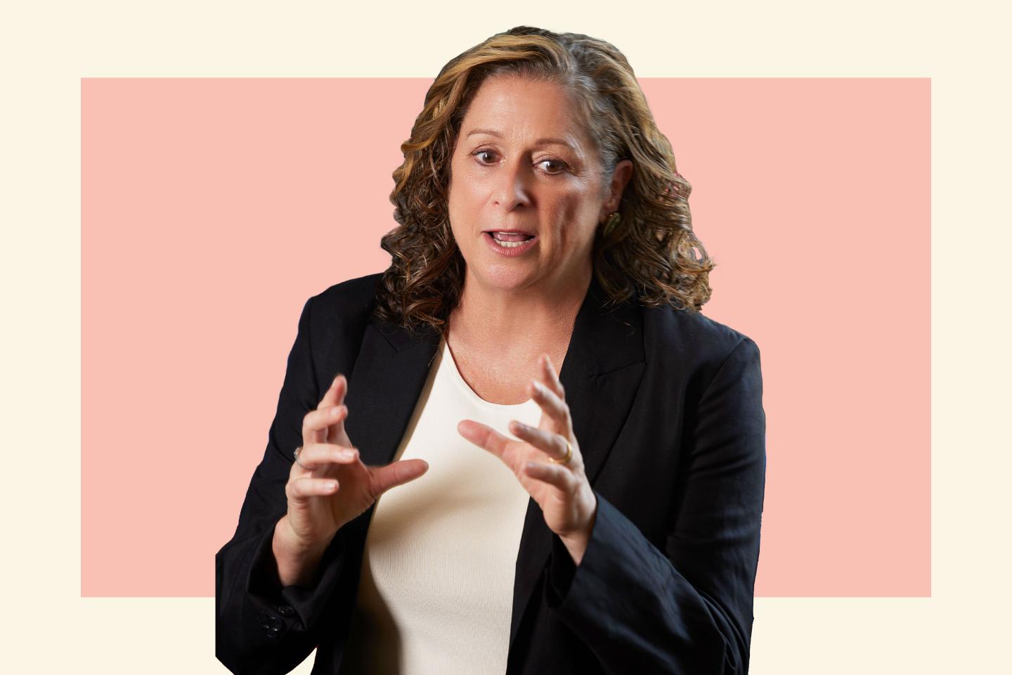 woman in suit jacket speaking
