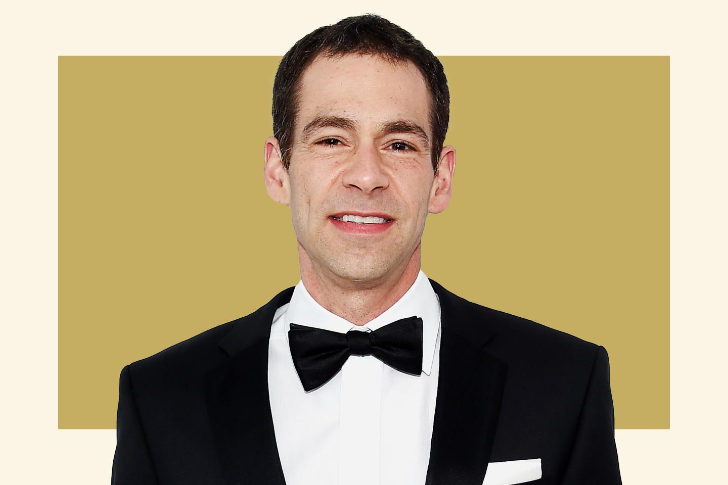 Man smiling and wearing a tuxedo