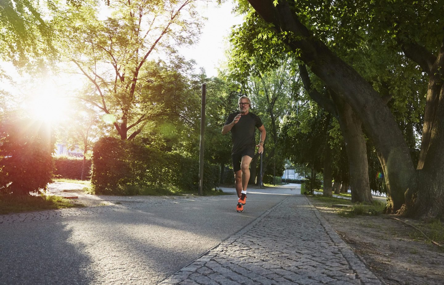 An active senior man doing exercise in the city of Berlin