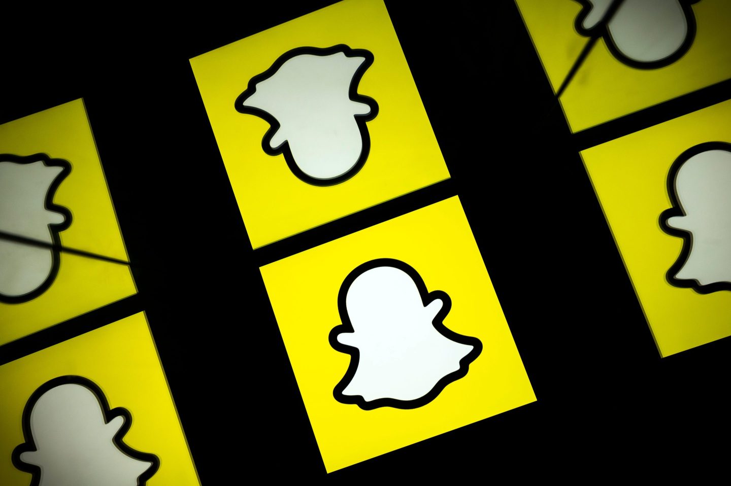 Six Snap logos appear on a screen.