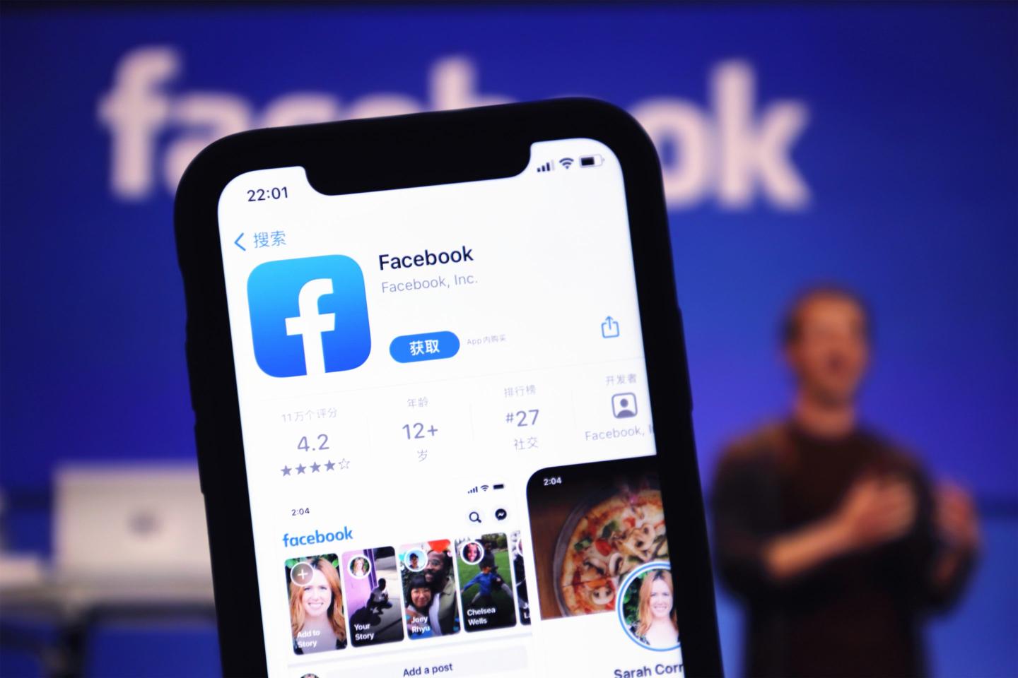 A mobile phone shows the Facebook interface