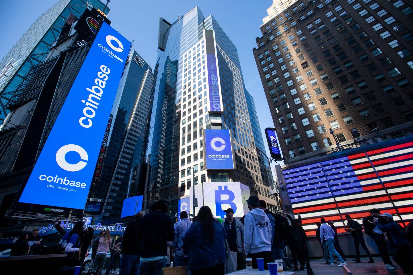 Coinbase employees in Times Square when the firm was first listed on the NASDAQ in April 2021.