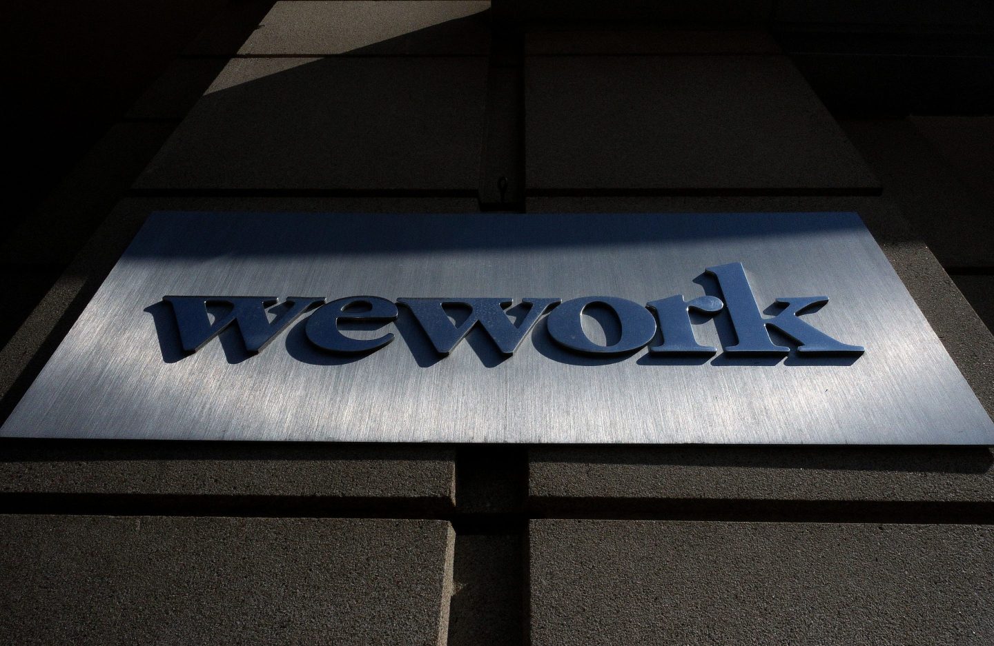 A WeWork sign in front of a building