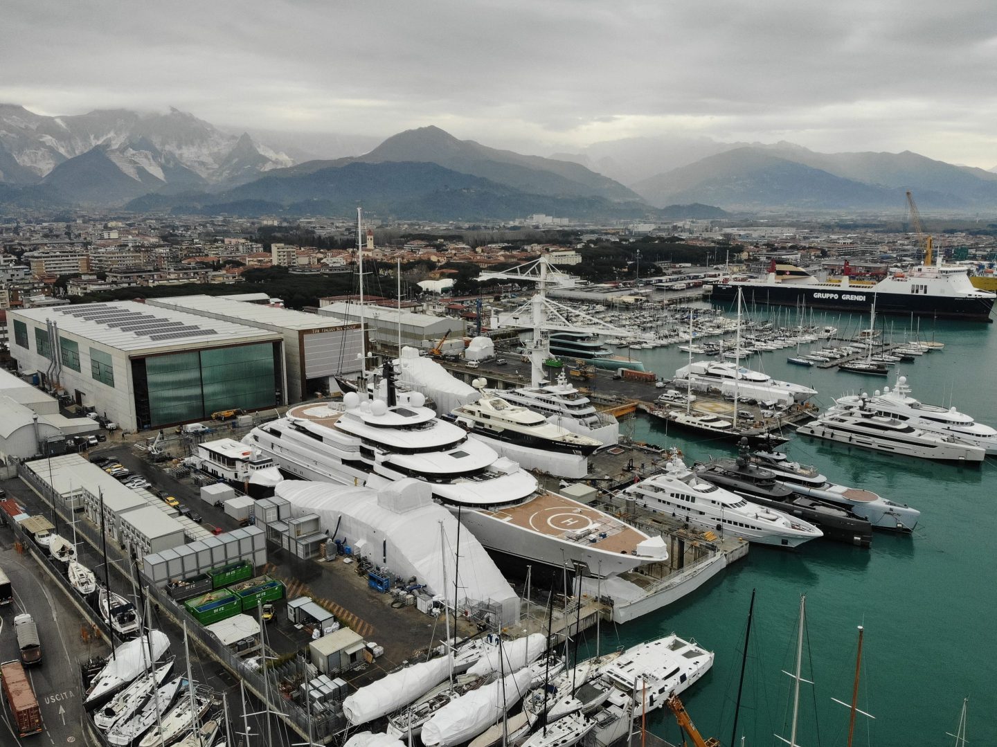 The Scheherazade (center), docked at the port of Marina di Carrara, Tuscany.