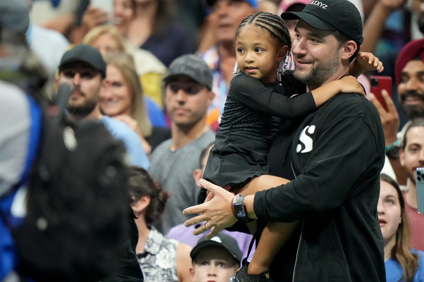 Alexis Ohanian and daughter Olympia Ohanian Jr looks on vs Danka Kovinic of Montenegro during Women's 1st Round match at Arthur Ashe Stadium. Flushing, NY 8/29/2022