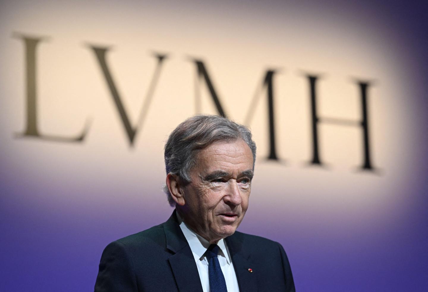 LVMH chairman and CEO Bernard Arnault with the fashion conglomerate's logo in the background
