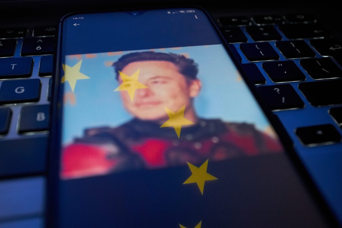 In this photo illustration Elon Musk Twitter with the flag of European Union (EU) seen displayed on a smartphone screen in Athens, Greece on March 8, 2023.