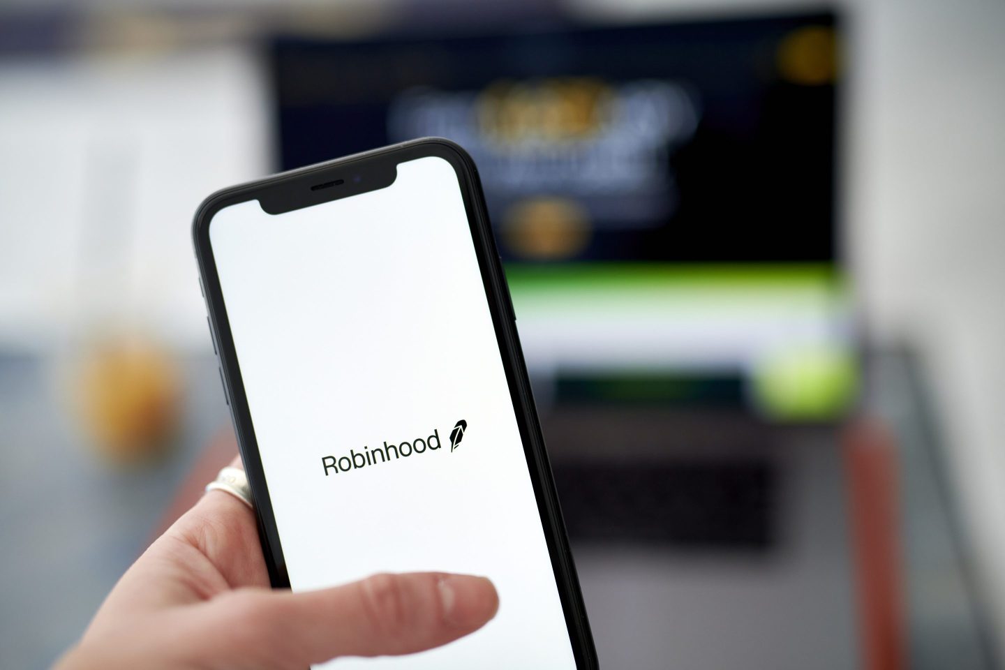 The Robinhood logo on a smartphone.