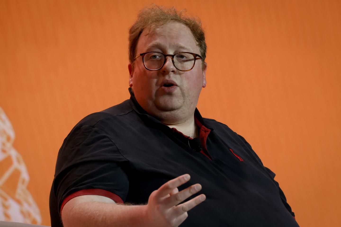 Oliver Linch speaks at the Bitcoin 2023 conference.