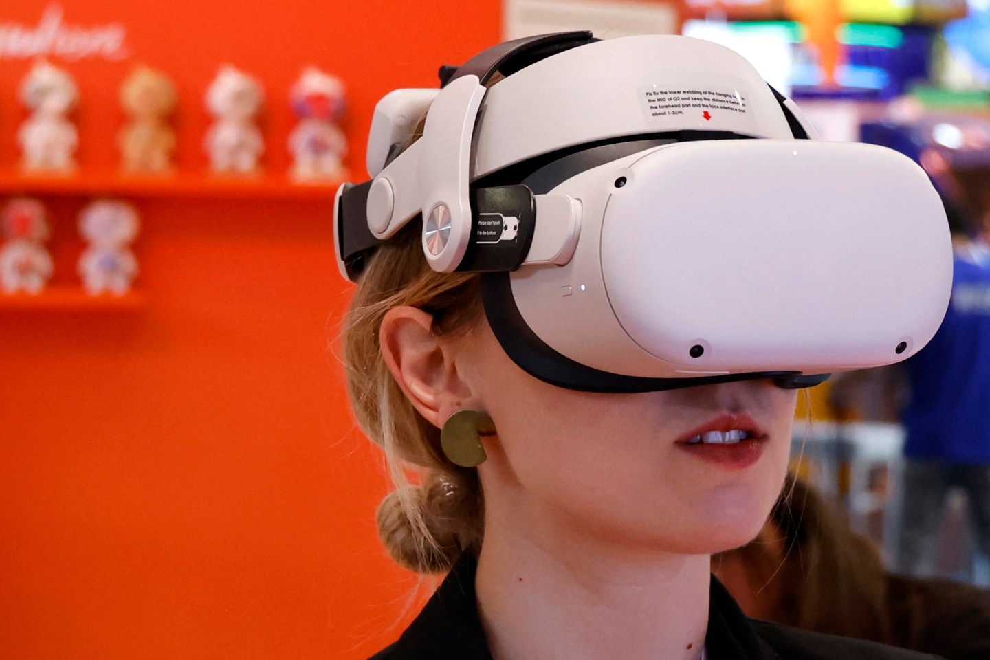 An attendee wears a virtual-reality (VR) headset at the Vivatech technology startups and innovation fair in Paris on June 14 2023.