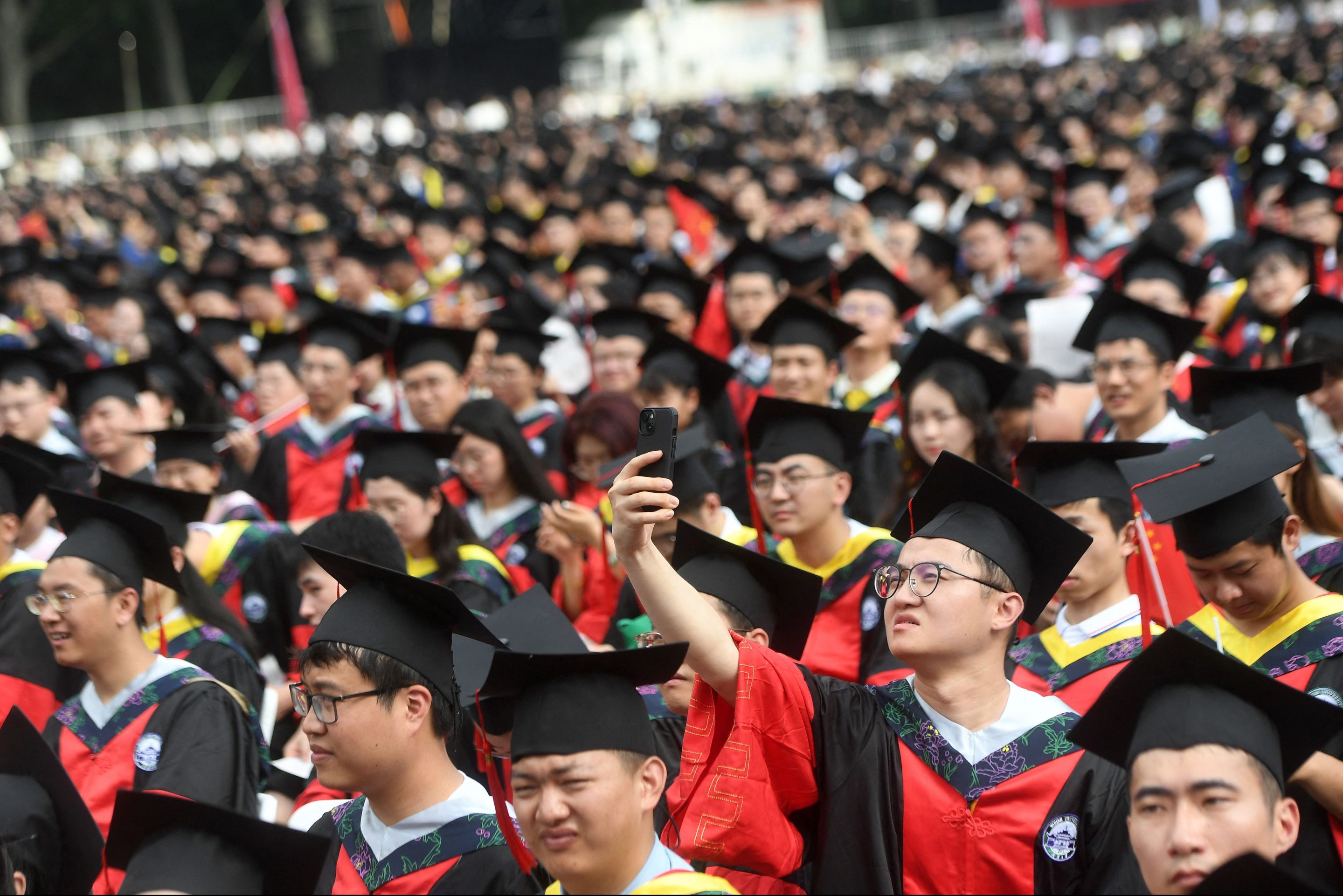 Wuhan University students attend a graduation ceremony on June 20, 2023.