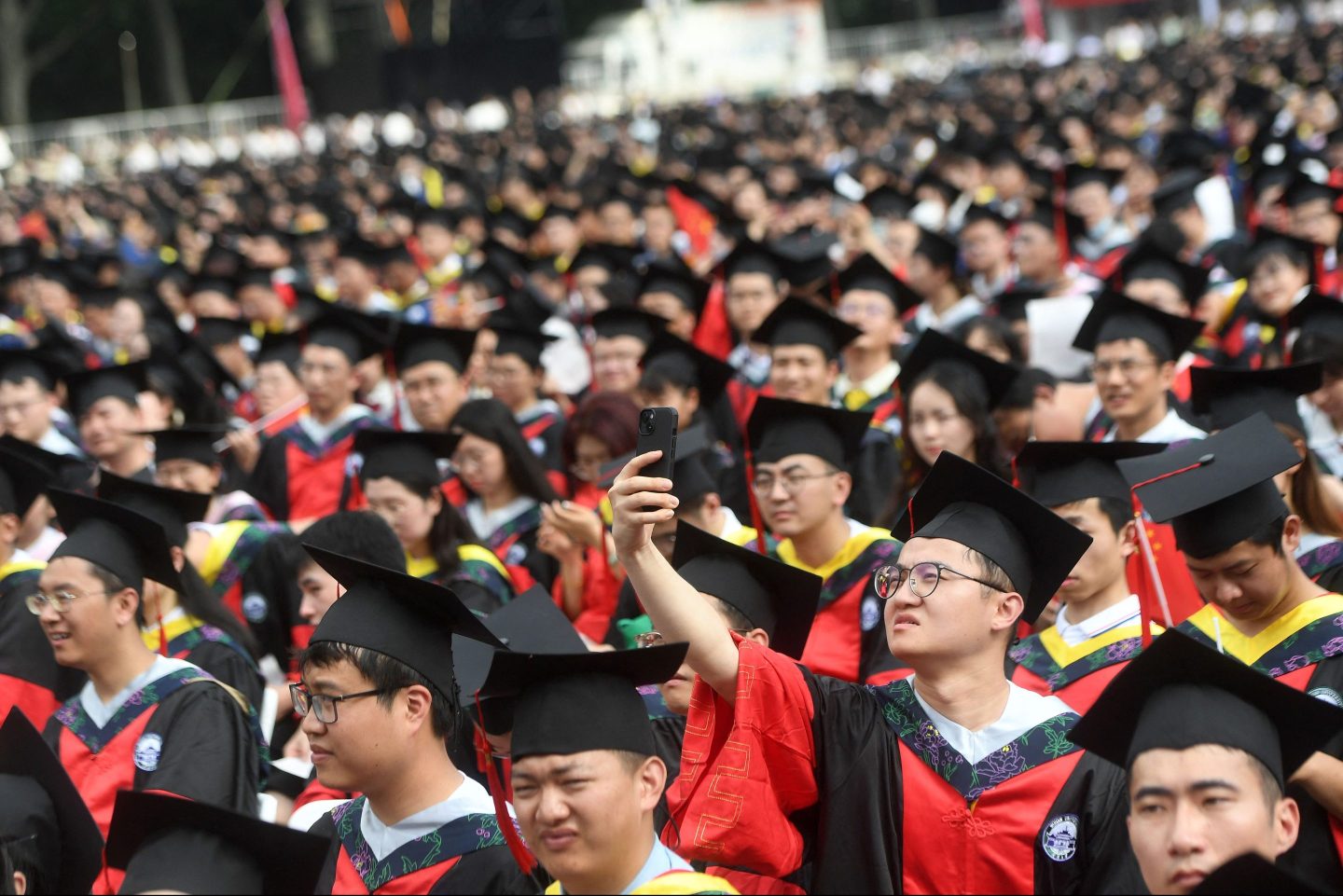 Wuhan University students attend a graduation ceremony on June 20, 2023.