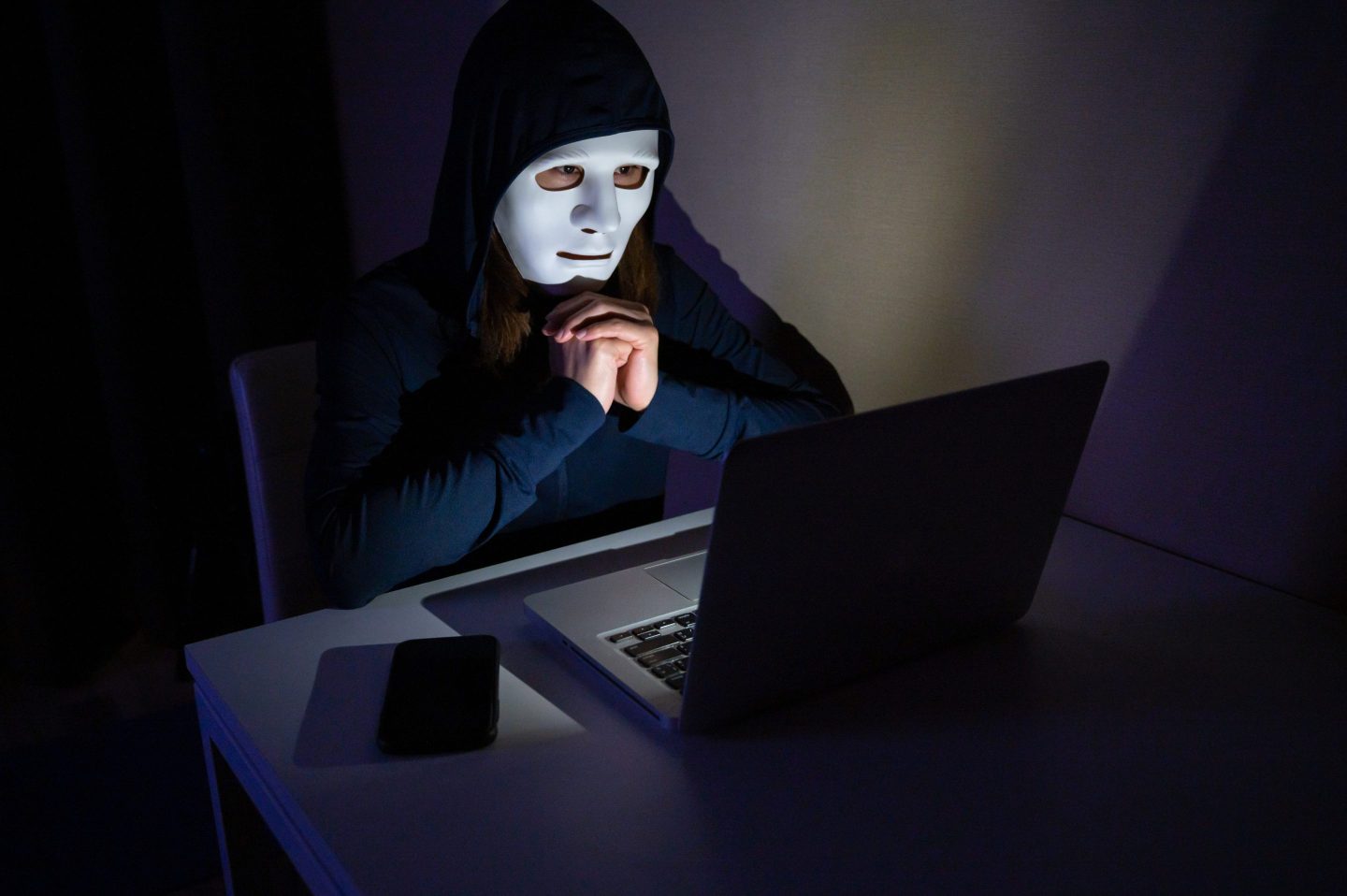 Unidentified female hacker trying to hacking internet server in the dark