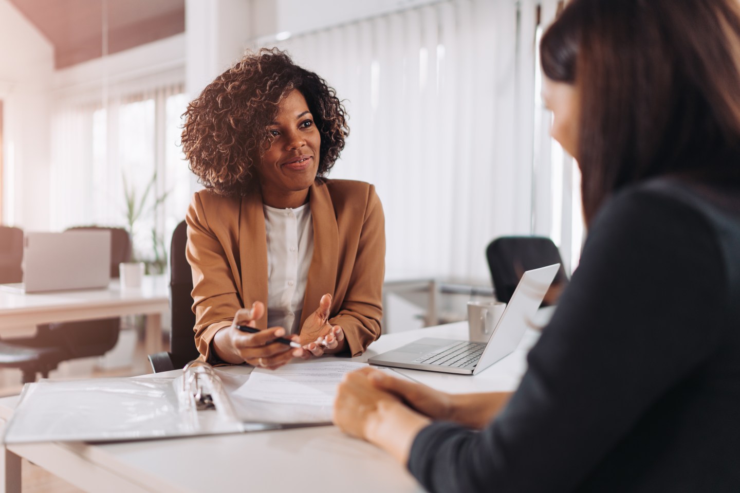 Young woman wearing professional clothing doing a job interview