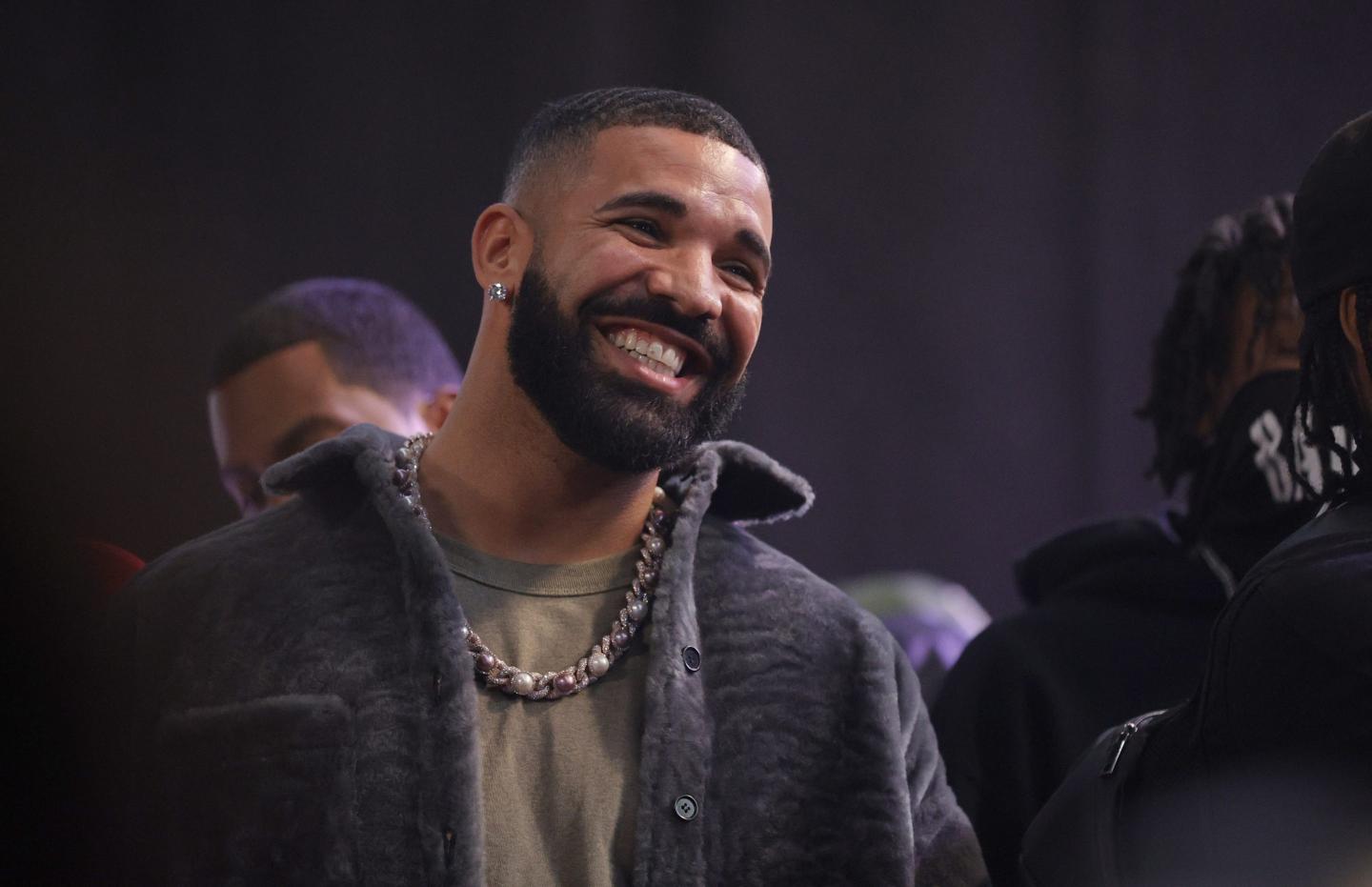 A smiling bearded man