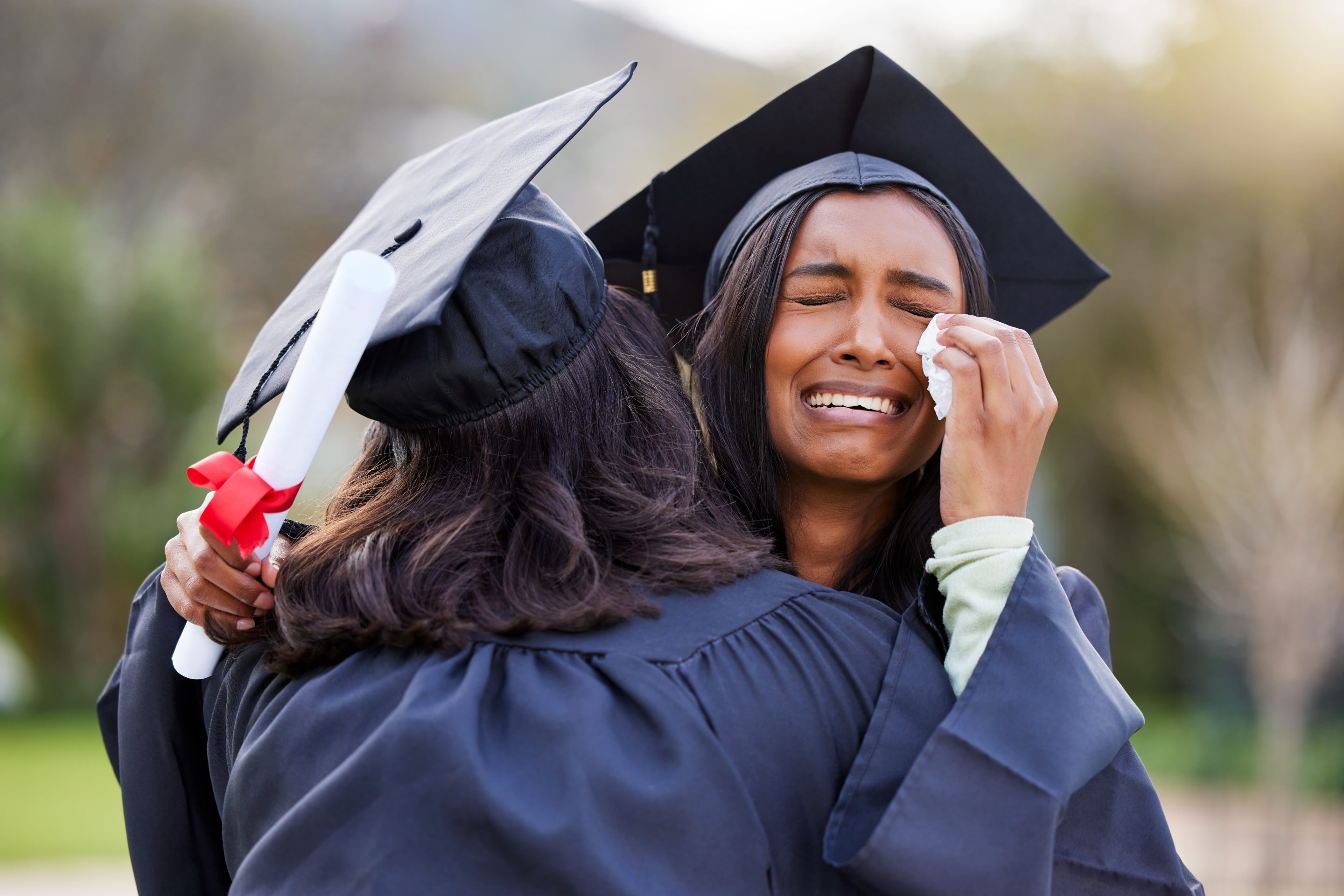 Graduates hugging and crying