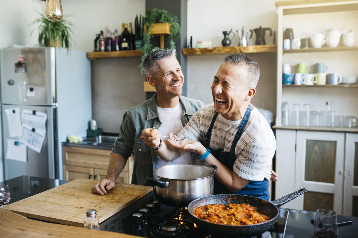 Two men in a kitchen cooking