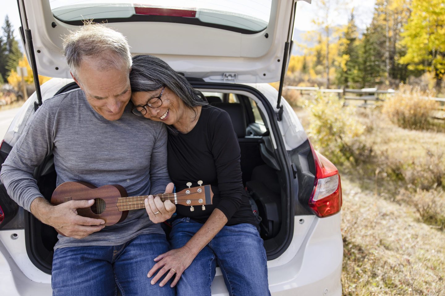 An older couple enjoying a road trip