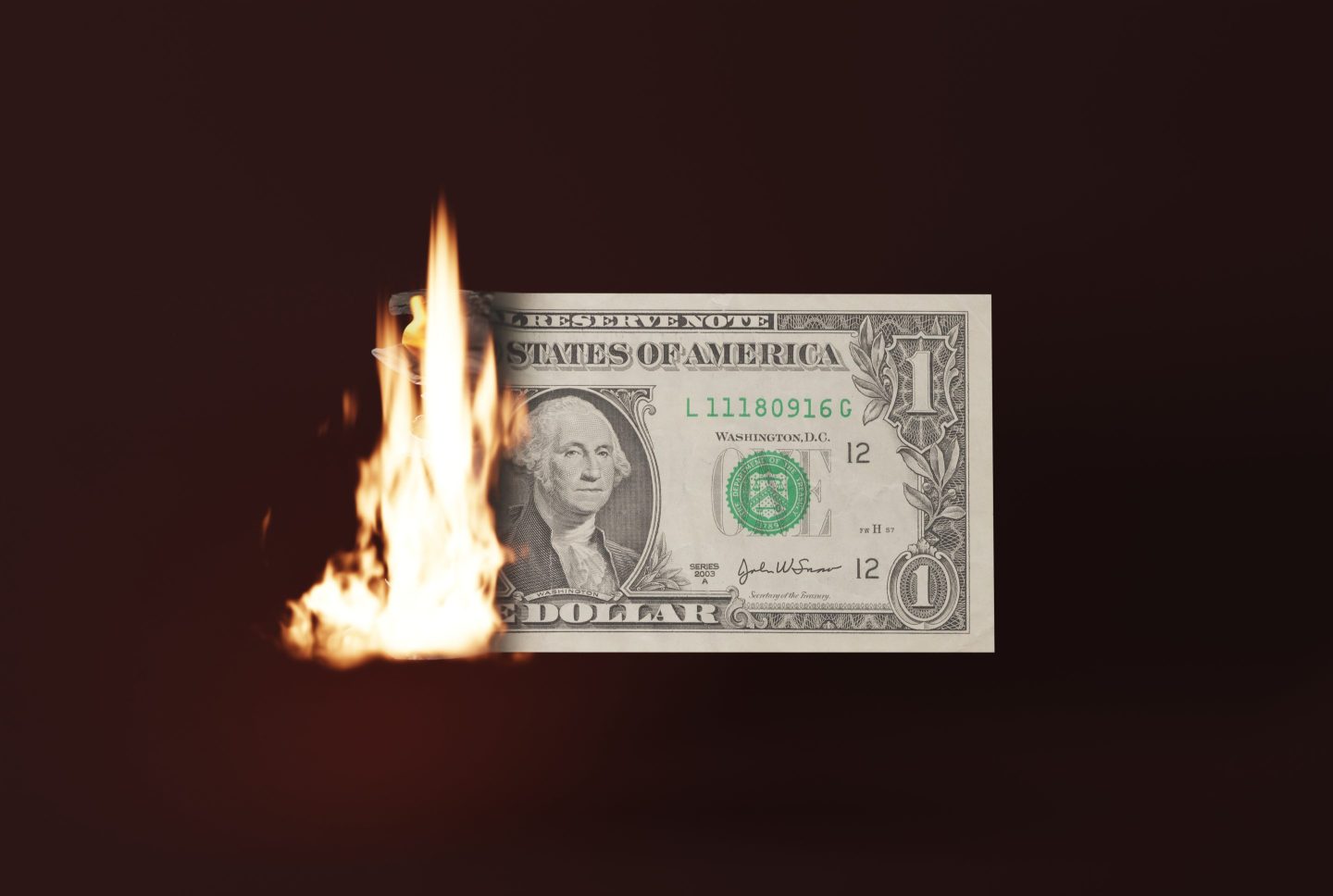 A dollar bill on fire