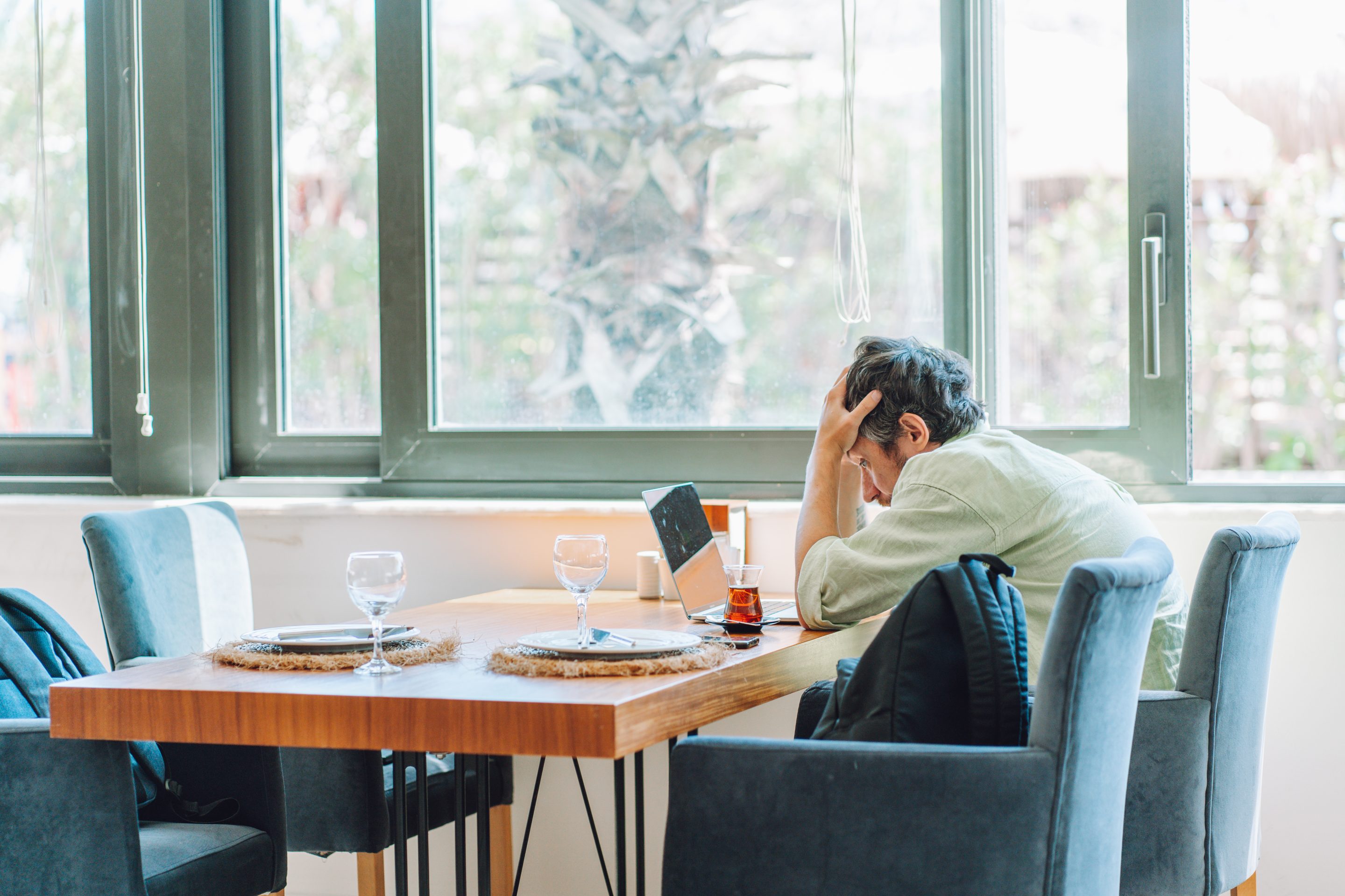 Distressed remote worker at laptop