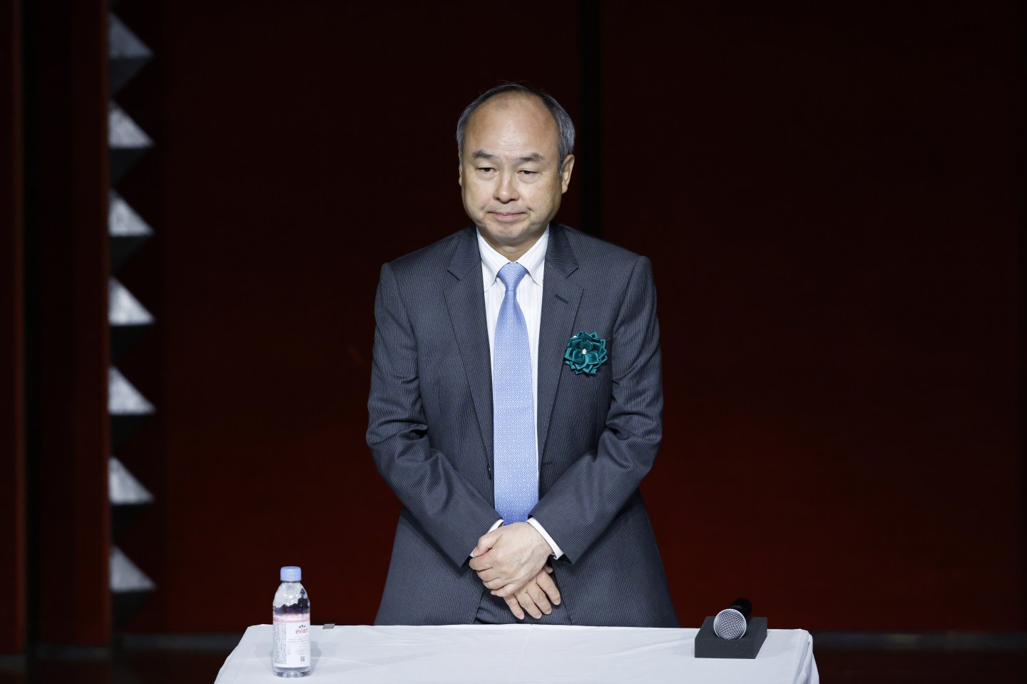 Man in suit standing at a podium