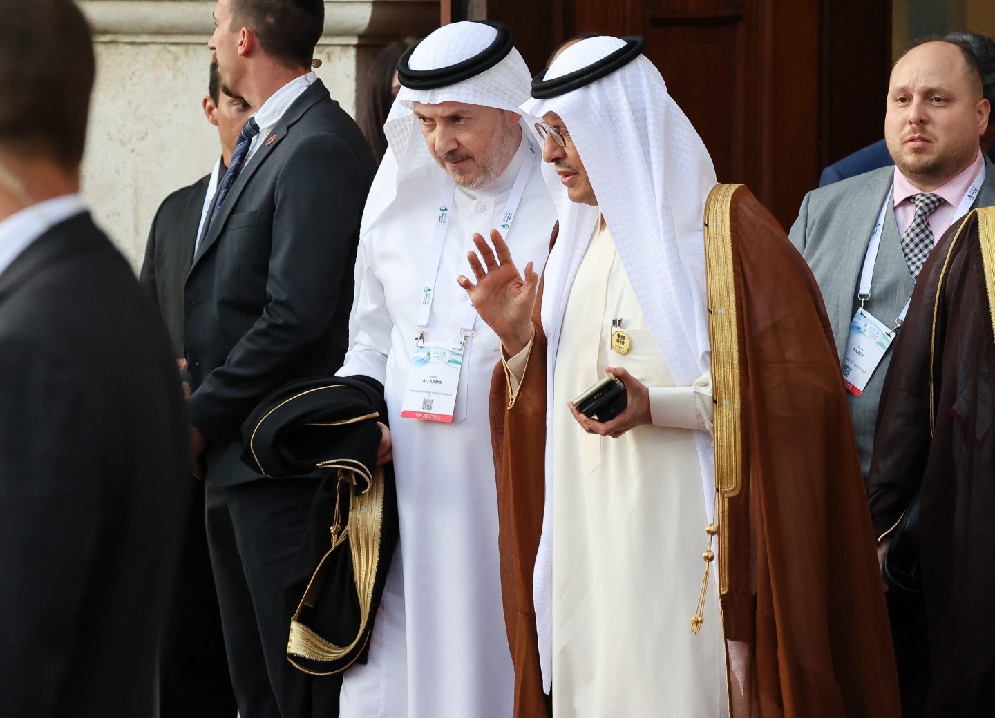 Adeeb Y Al Aama, governor of Organization of Petroleum Exporting Countries (OPEC), center, and Prince Abdulaziz bin Salman, Saudi Arabia's energy minister, right, exit after attending the 8th OPEC International Seminar in Vienna, Austria, on July 5, 2023.