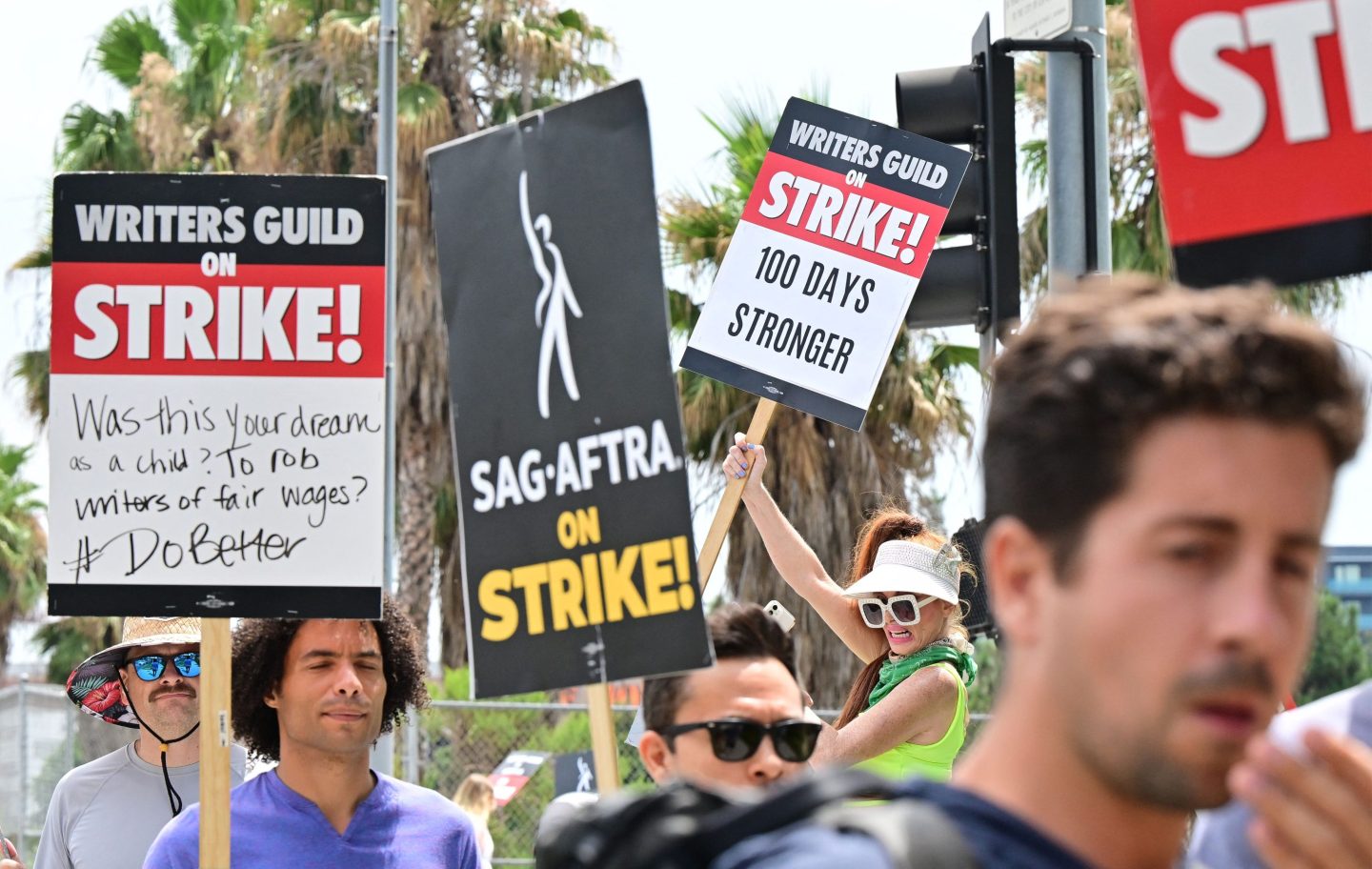 Writers Guild of America and the Screen Actors Guild members walk the picket line outside of Netflix in Hollywood, California, on Wednesday.
