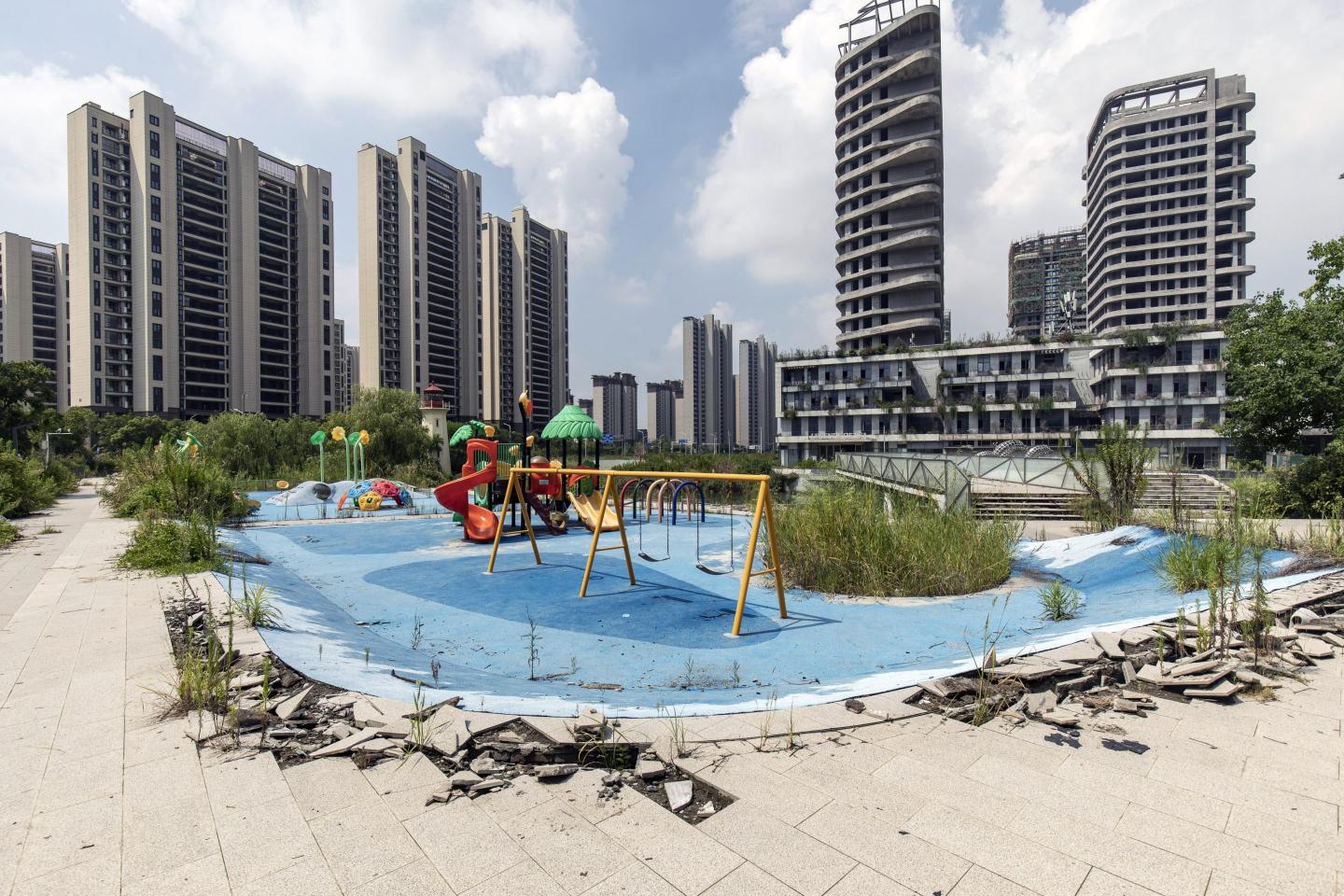 A deserted playground in front of residential buildings at the Legend of Sea project, codeveloped by Country Garden Holdings and Jiangsu Zhongnan Construction Industry Group, in Ningbo, China, on Wednesday, Aug. 16, 2023.