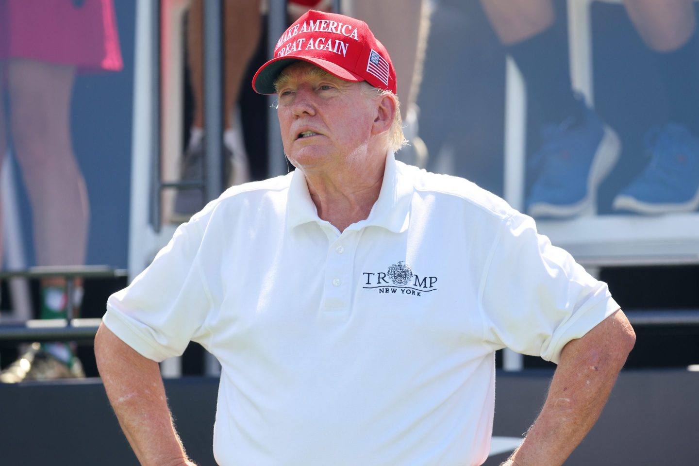 Donald Trump is seen wearing a red cap